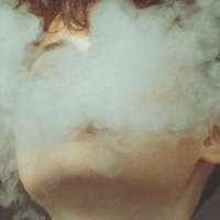 persons face hidden by smoke